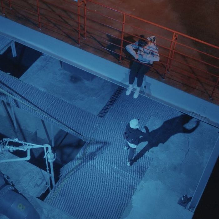 Two performers occupying different vertical levels inside the former water-intake facility