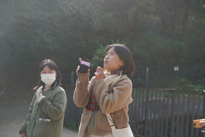 A participant speaking through a walkie-talkie